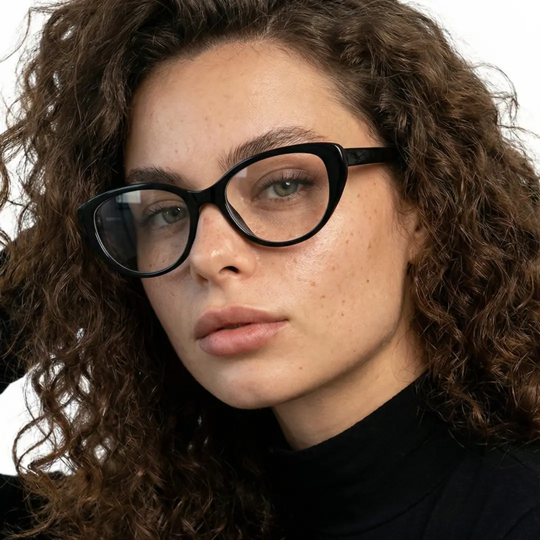 Three-quarter view of female wearing black cat eye eyeglasses, confident expression, CR0142404