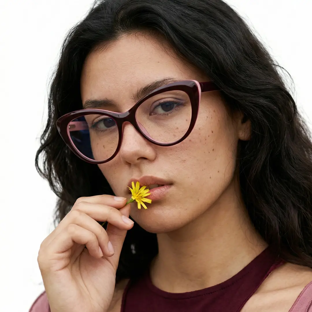 Face close-up view of female wearing pink cat eye eyeglasses, neutral expression, CR0142502
