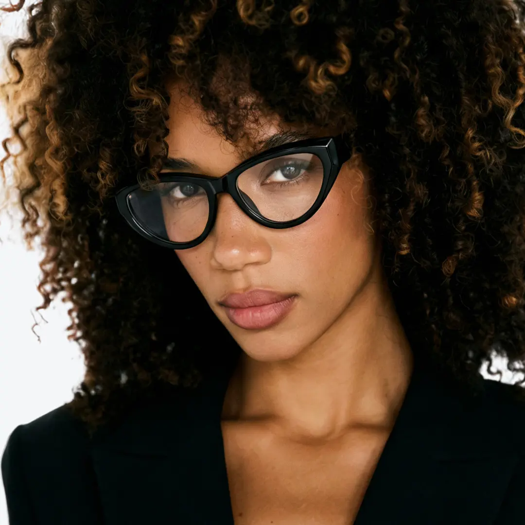 Looking straight ahead view of female wearing black cat eye eyeglasses, confident expression, CR0152412