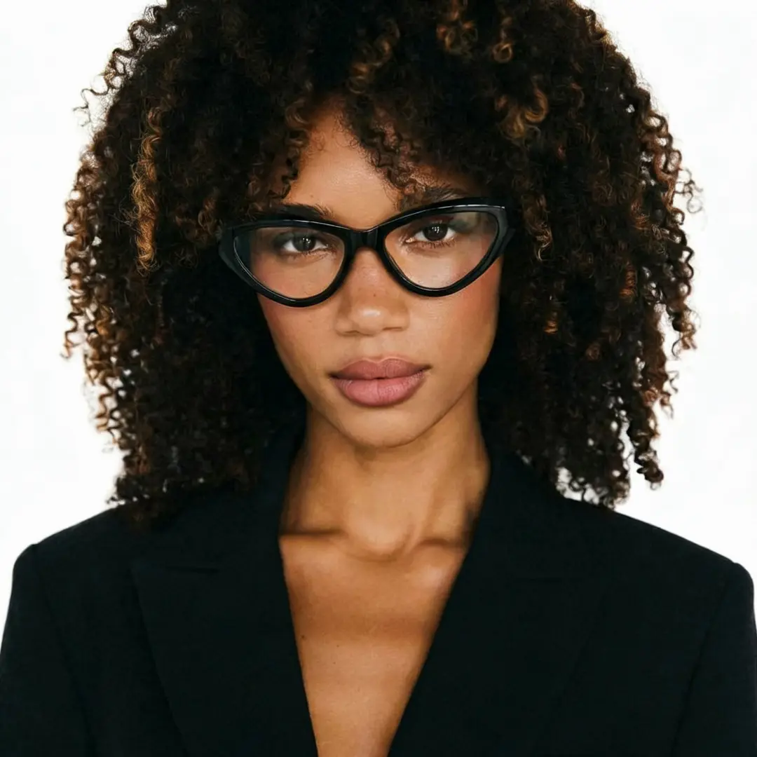 Straight-on view of female wearing black cat eye eyeglasses, neutral expression, CR0152412