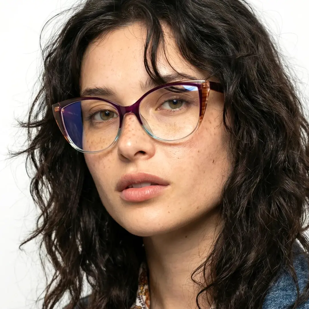 Three-quarter view of female wearing colorful two-tone (purple and cear) cat eye eyeglasses, neutral expression, CR0172307