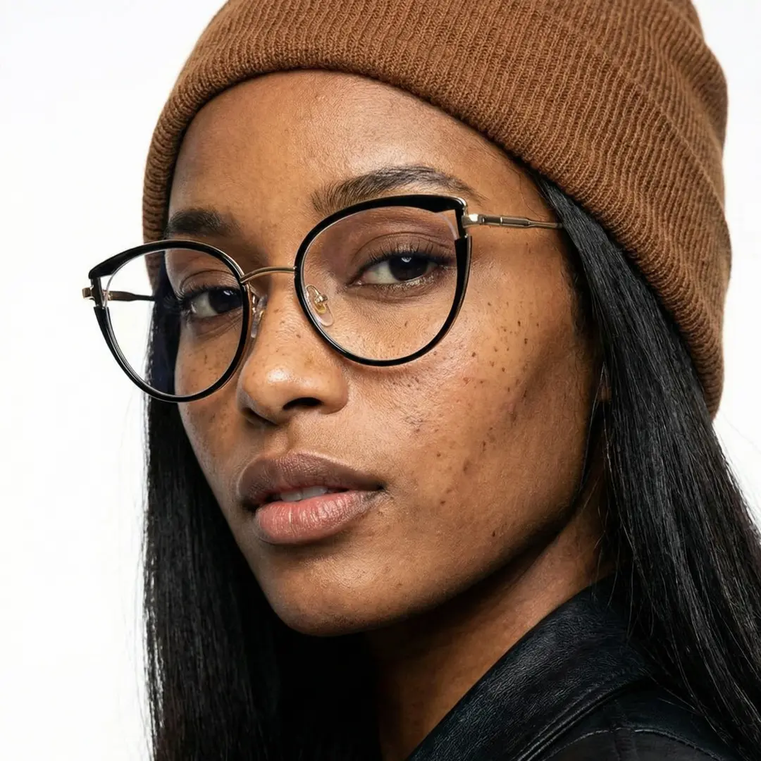 Three-quarter view of female wearing black cat eye eyeglasses, calm expression, CR0182411