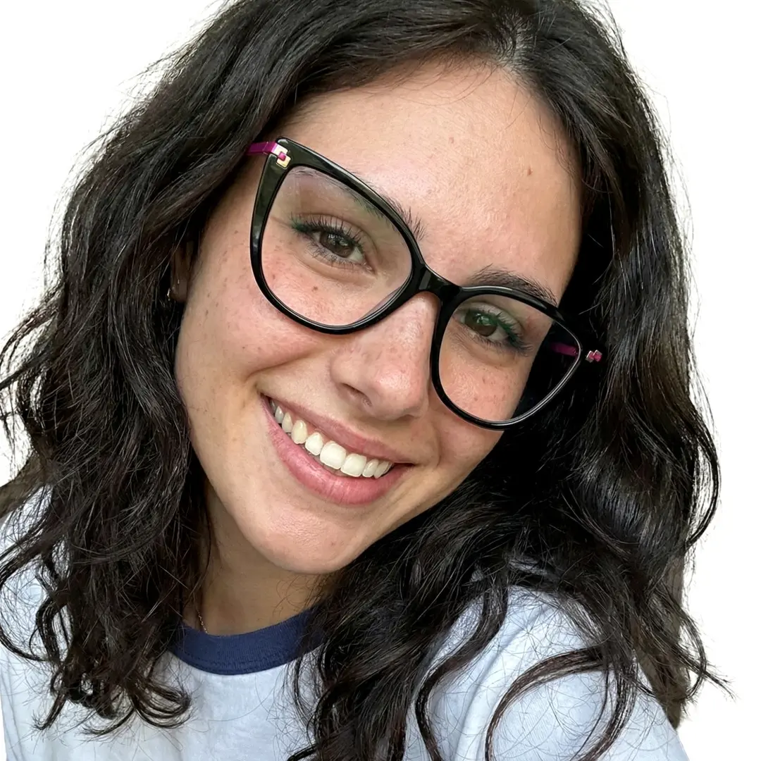 Front view of female wearing black cat eye eyeglasses, smiling, CR0182502