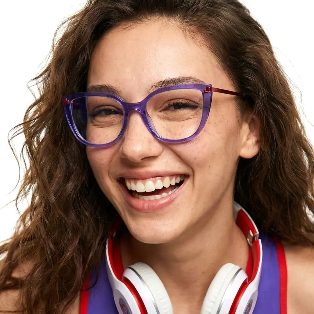 Front view of female wearing purple cat eye eyeglasses, smiling, CR0182502