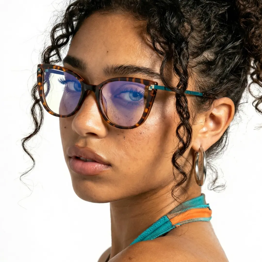 Three-quarter view of female wearing tortoise cat eye eyeglasses, calm expression, CR0182502