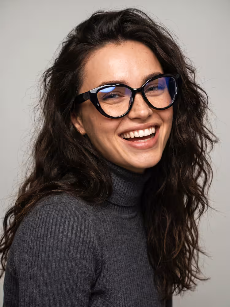 Female model wearing everyday black cat eye tr90 eyeglasses in a clean studio setting. SPU:CR0192604