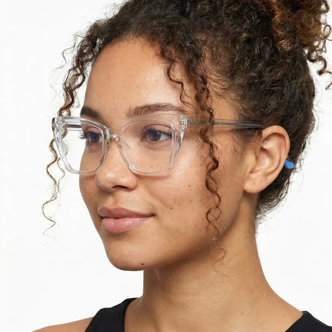 Three-quarter view of female wearing clear cat eye eyeglasses, natural smile, CR0212502