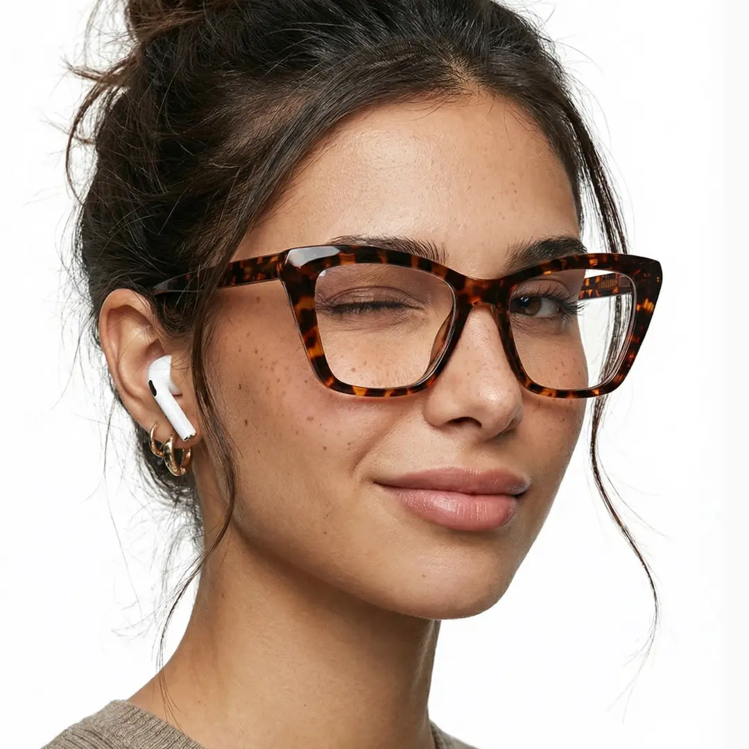 Three-quarter view of female wearing tortoise cat eye eyeglasses, winking, CR0212502