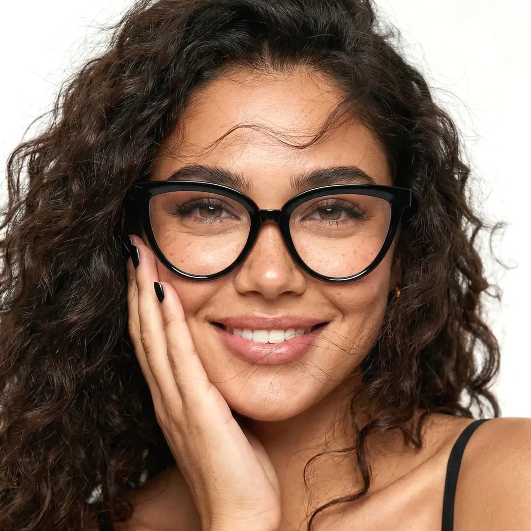 Front view of female wearing black cat eye eyeglasses, smiling, CR0222411