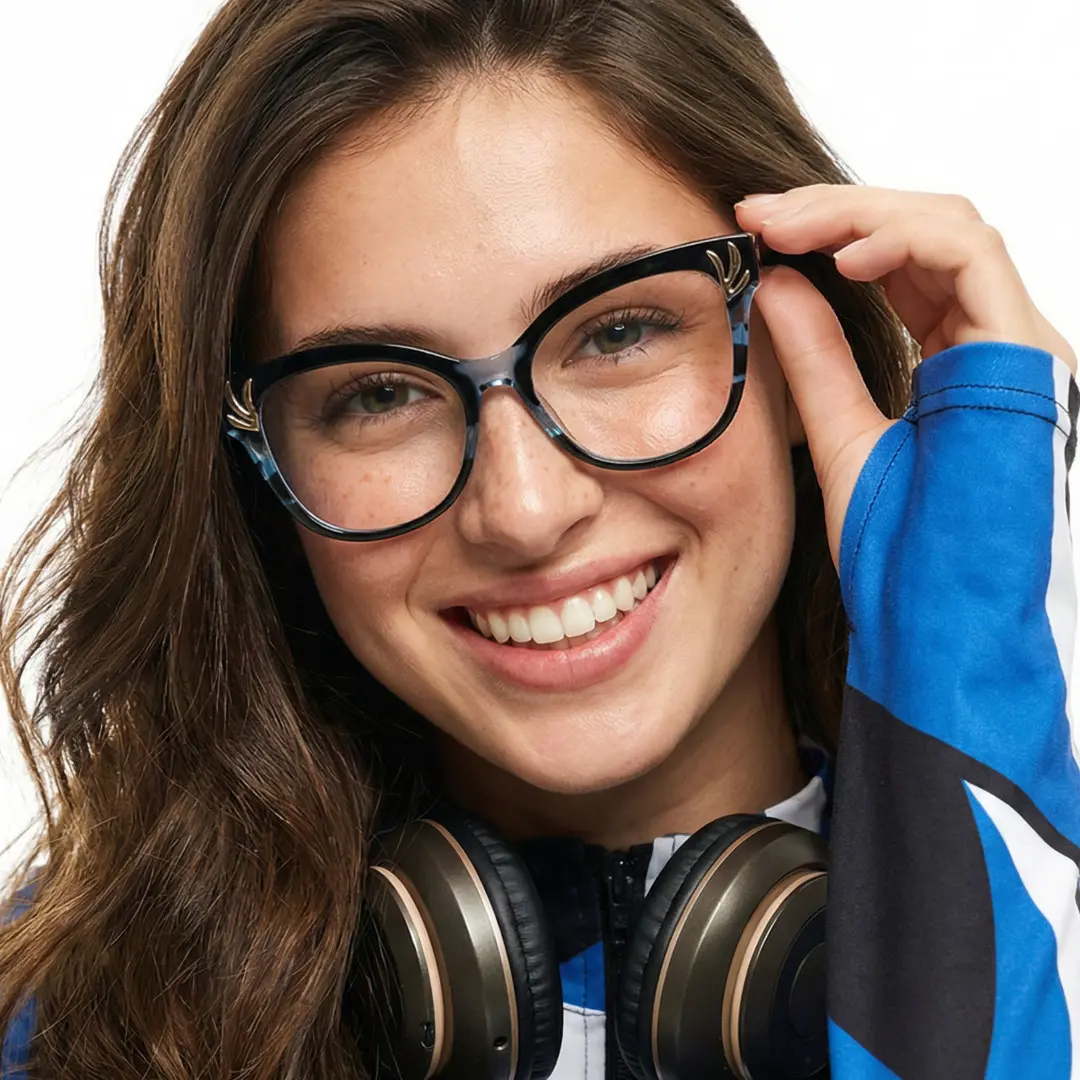 Front view of female wearing black cat eye eyeglasses, holding glasses, smiling, CR0232408