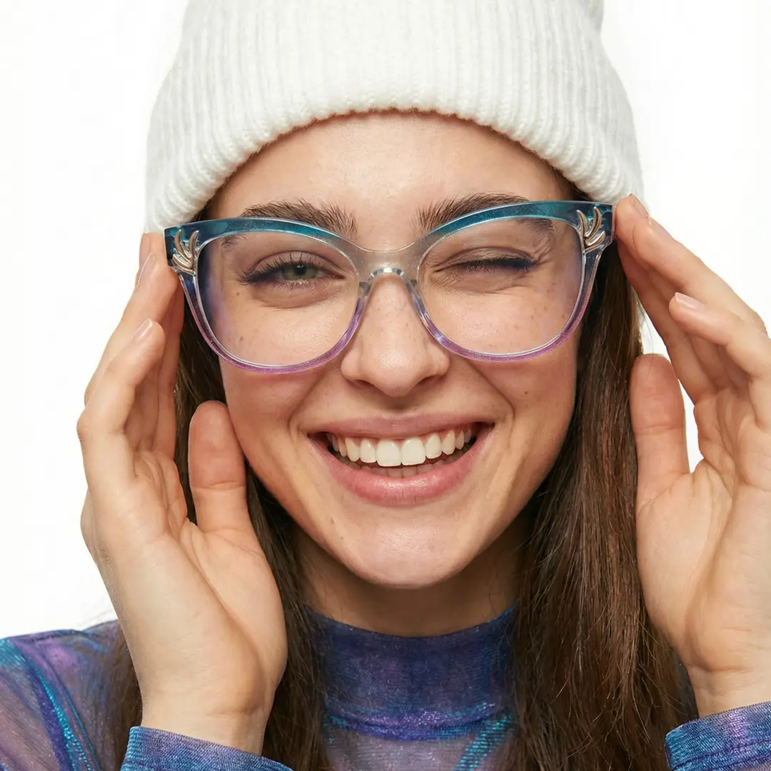 Front view of female wearing clear cat eye eyeglasses, smiling, CR0232408