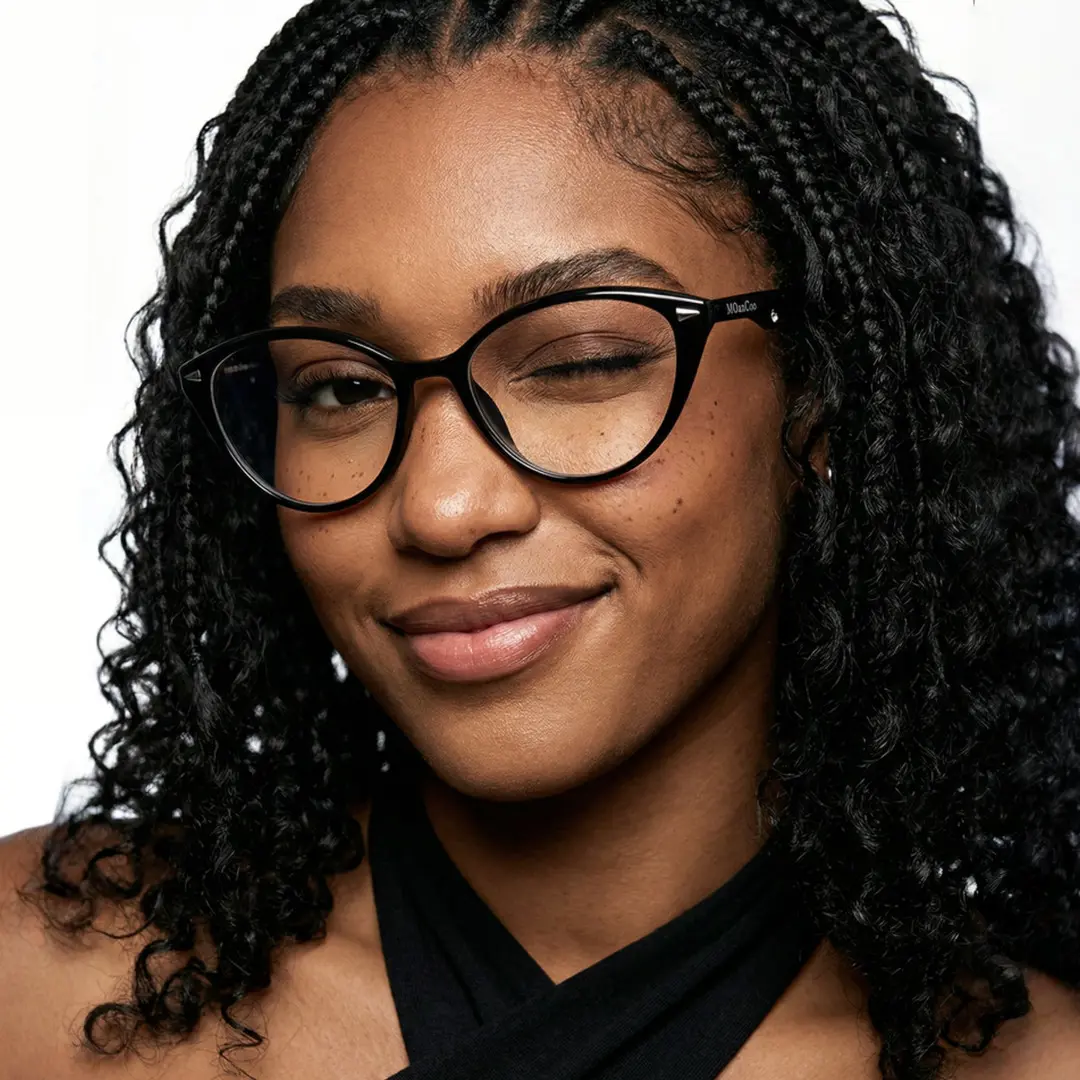 Slightly angled view of female wearing fashion black cat eye eyeglasses, winking, CR0232601