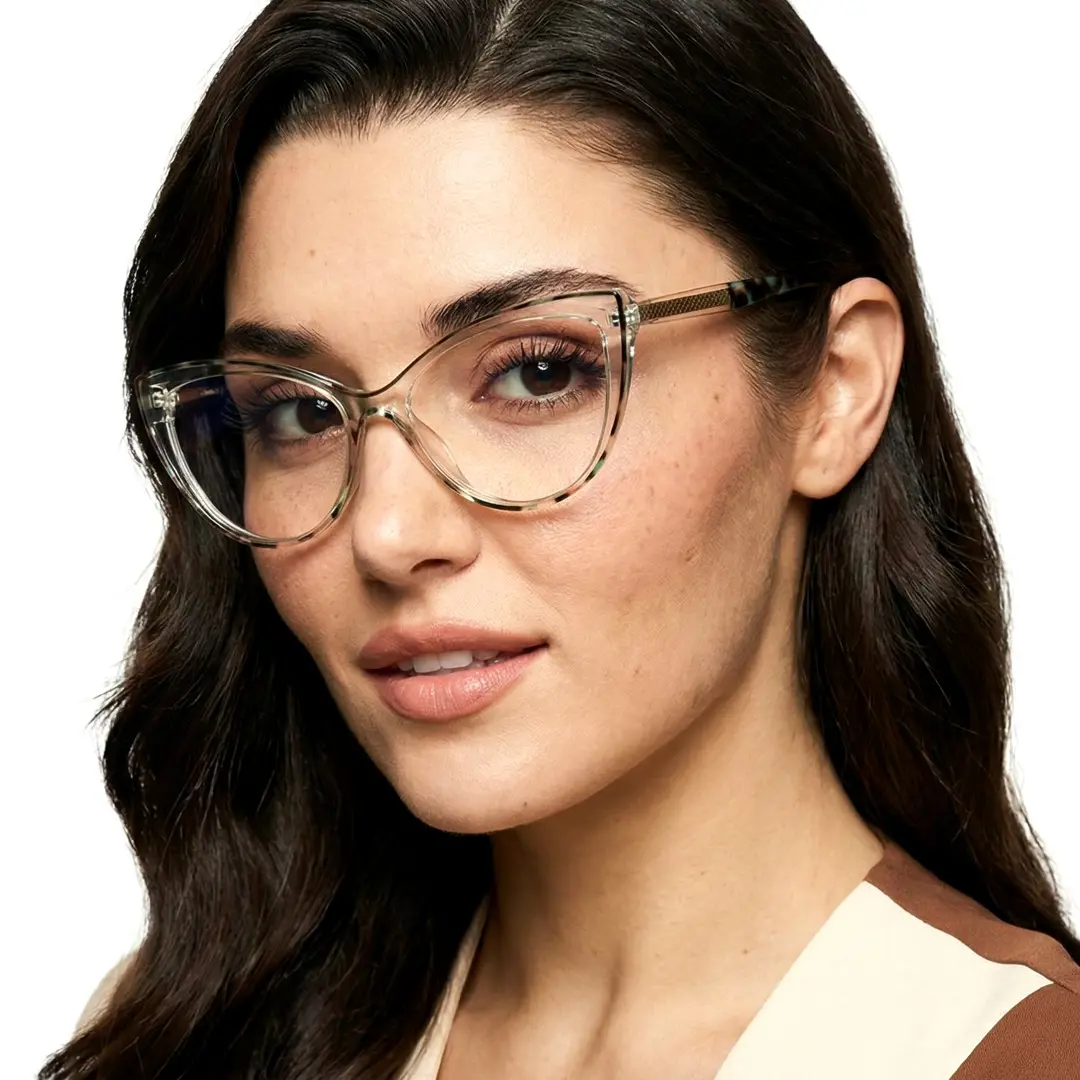Three-quarter view of female wearing blue tortoise cat eye eyeglasses, smiling, CR0242408