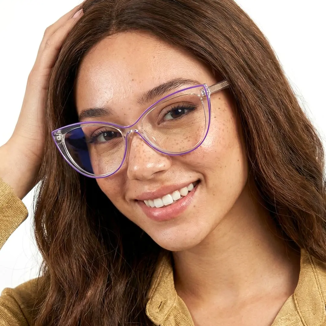 Front view of female wearing purple cat eye eyeglasses, hand in hair, smiling, CR0242408