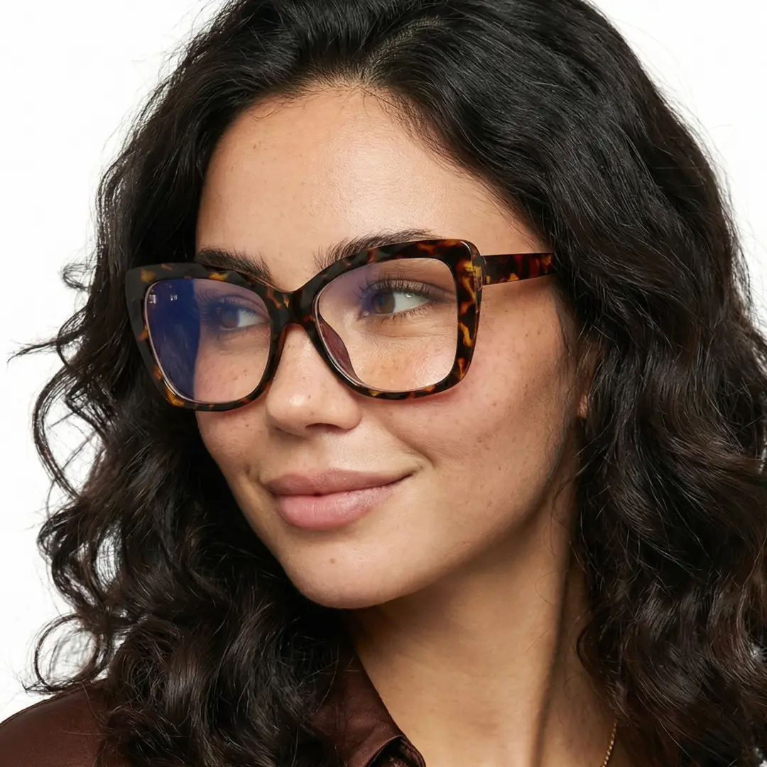 Profile view of female wearing tortoise cat eye eyeglasses, natural smile, CR0242502