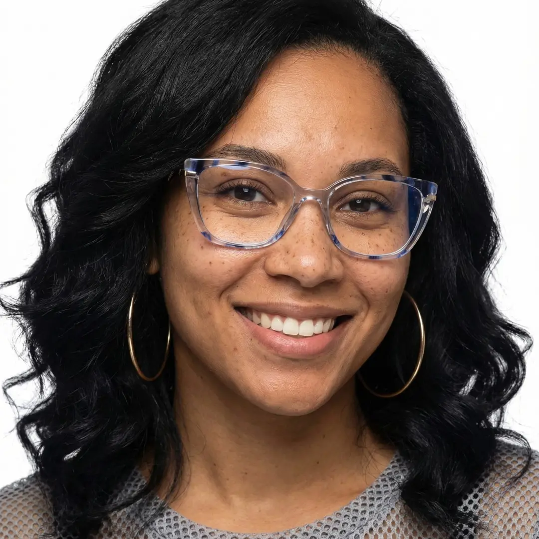 Front view of female wearing blue cat eye eyeglasses, smiling, CR0252408