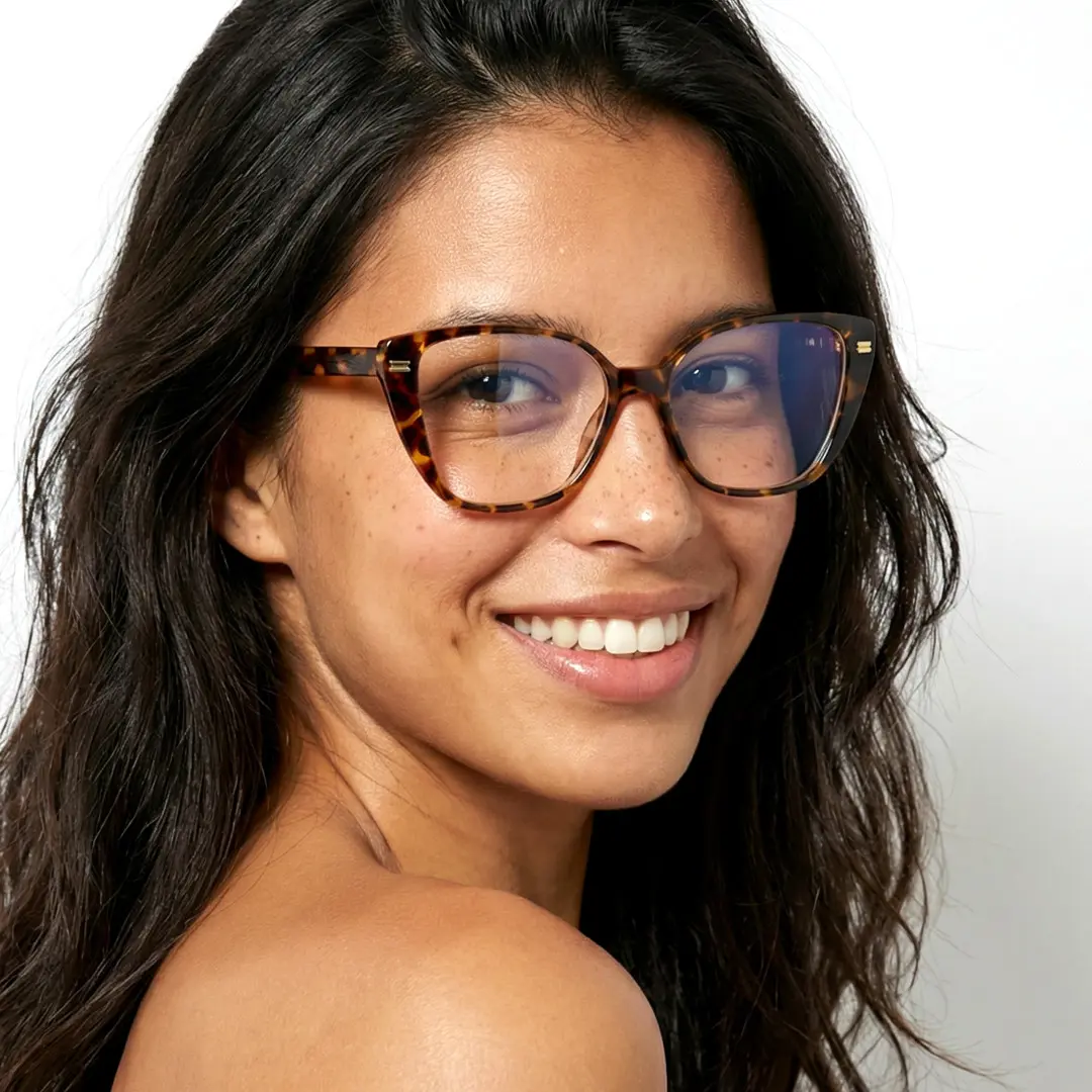 Over-the-shoulder view of female wearing tortoise cat eye eyeglasses, wide smile, CR0252411