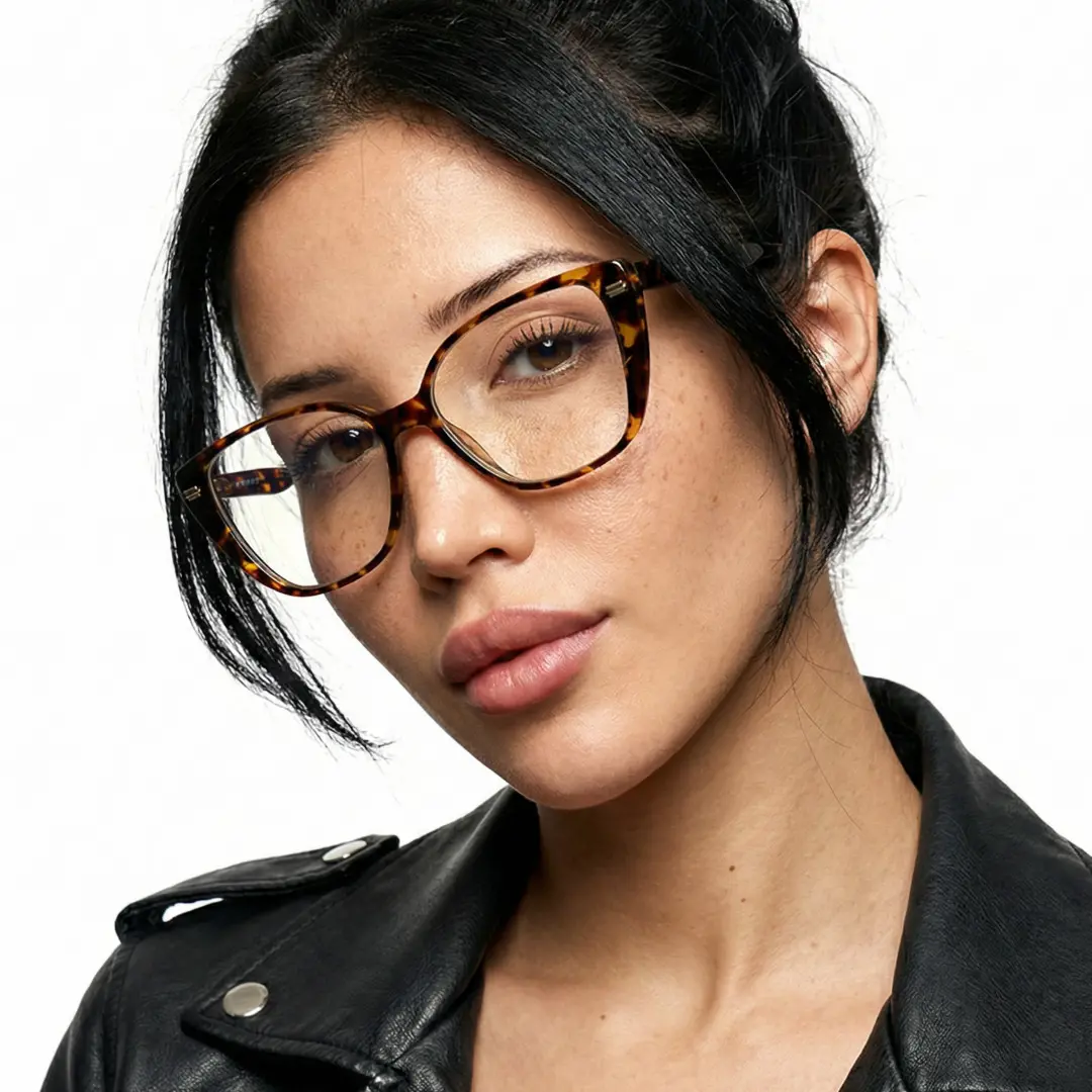 Three-quarter view of female wearing tortoise cat eye eyeglasses, calm expression, CR0252411
