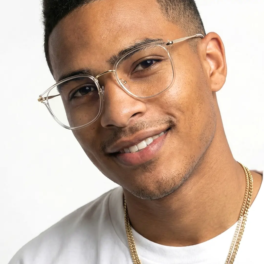 Three-quarter view of male wearing clear cat eye eyeglasses, smiling, CR0252502