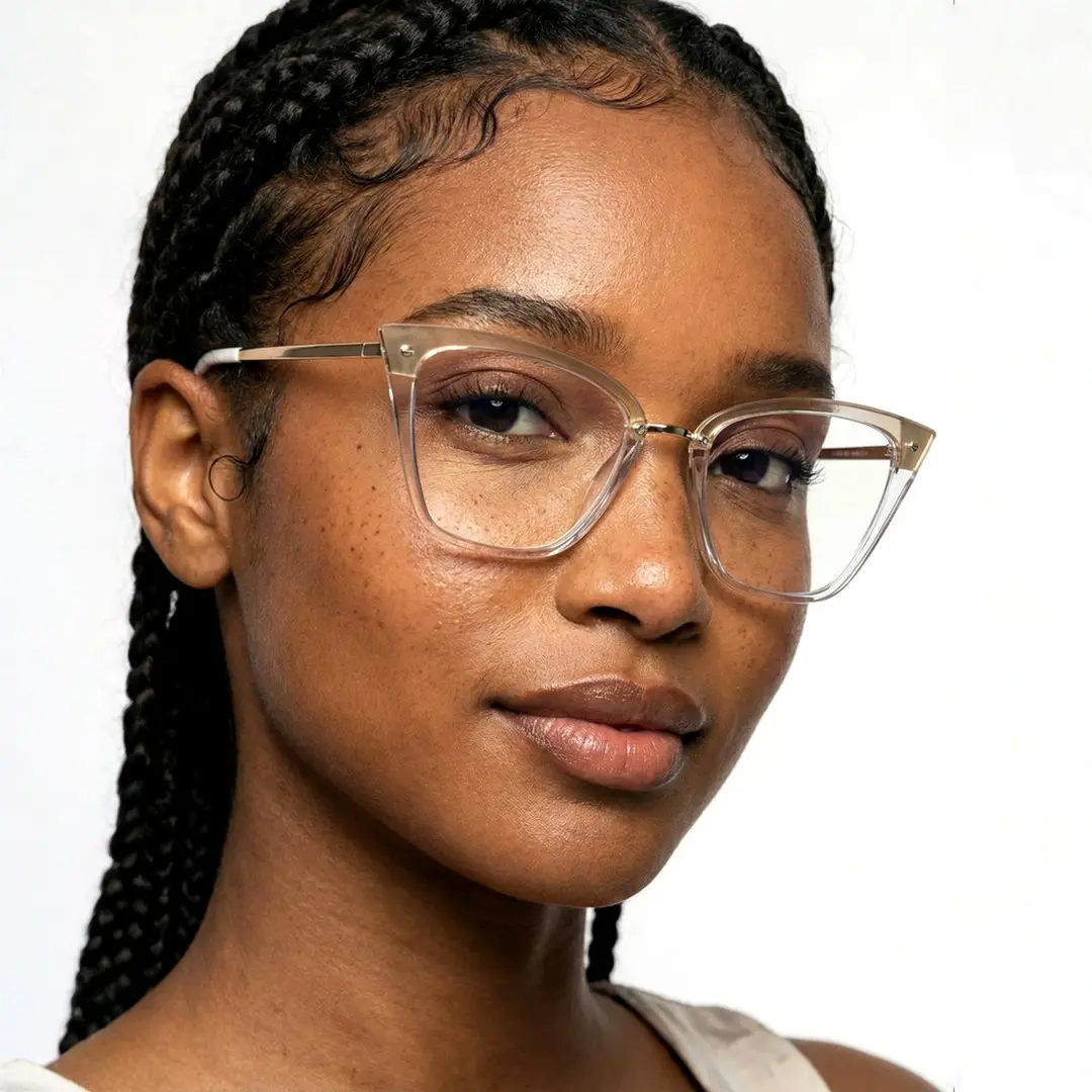 Looking straight ahead view of female wearing gold cat eye eyeglasses, calm expression, CR0292302