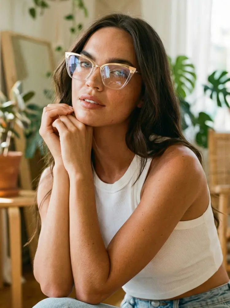 Female model wearing modern gold cat eye tr90 eyeglasses in an indoor setting with plants. SPU: CR0292302