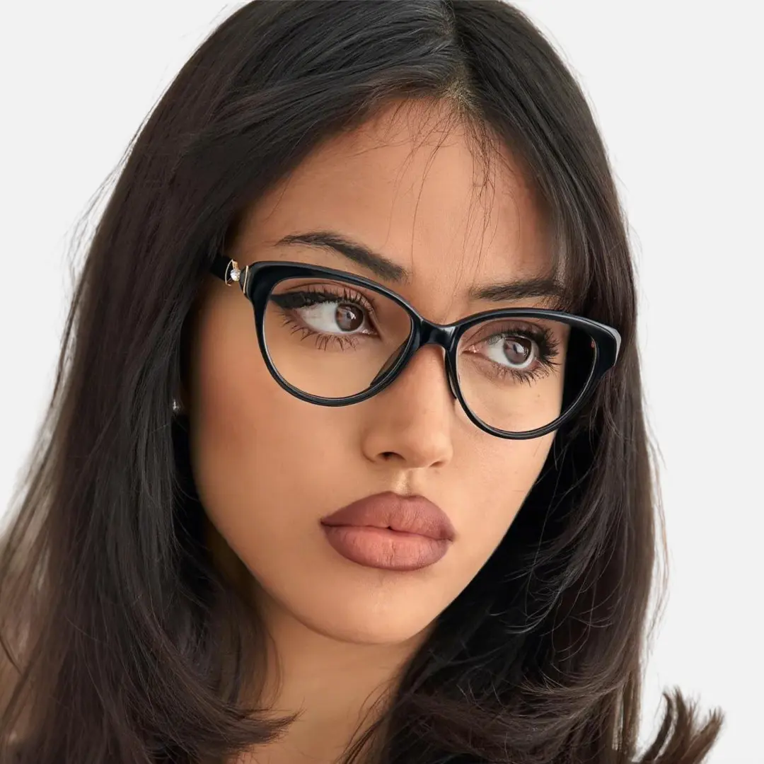 Front view of female wearing black cat eye eyeglasses, relaxed expression, CR0302509