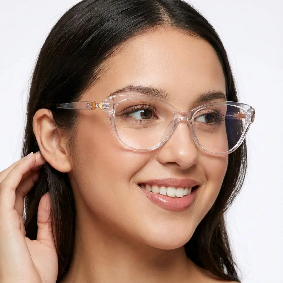 Looking away view of female wearing clear cat eye eyeglasses, hand in hair, soft smile, CR0302509