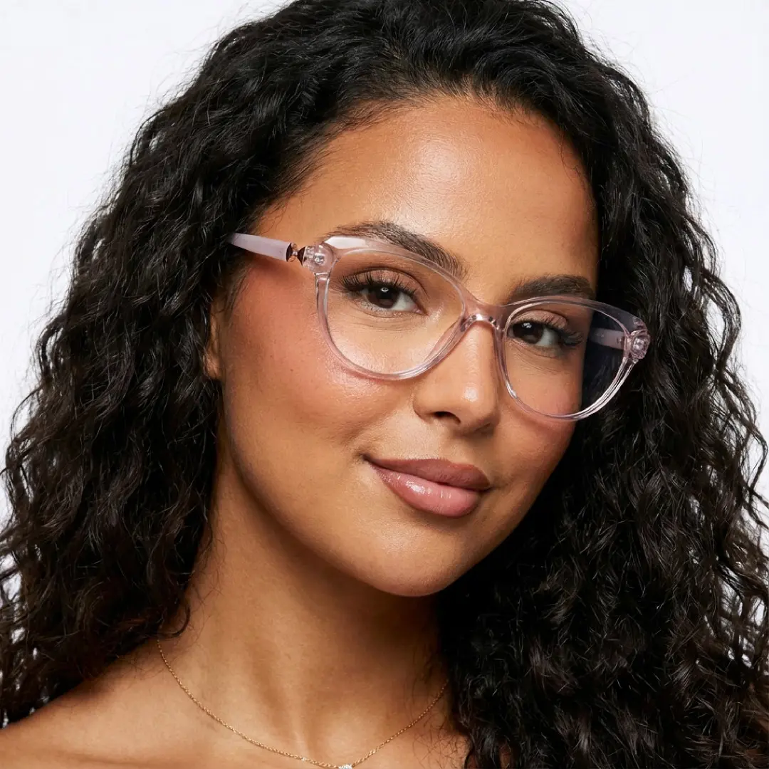 Front view of female wearing purple cat eye eyeglasses, natural smile, CR0302509