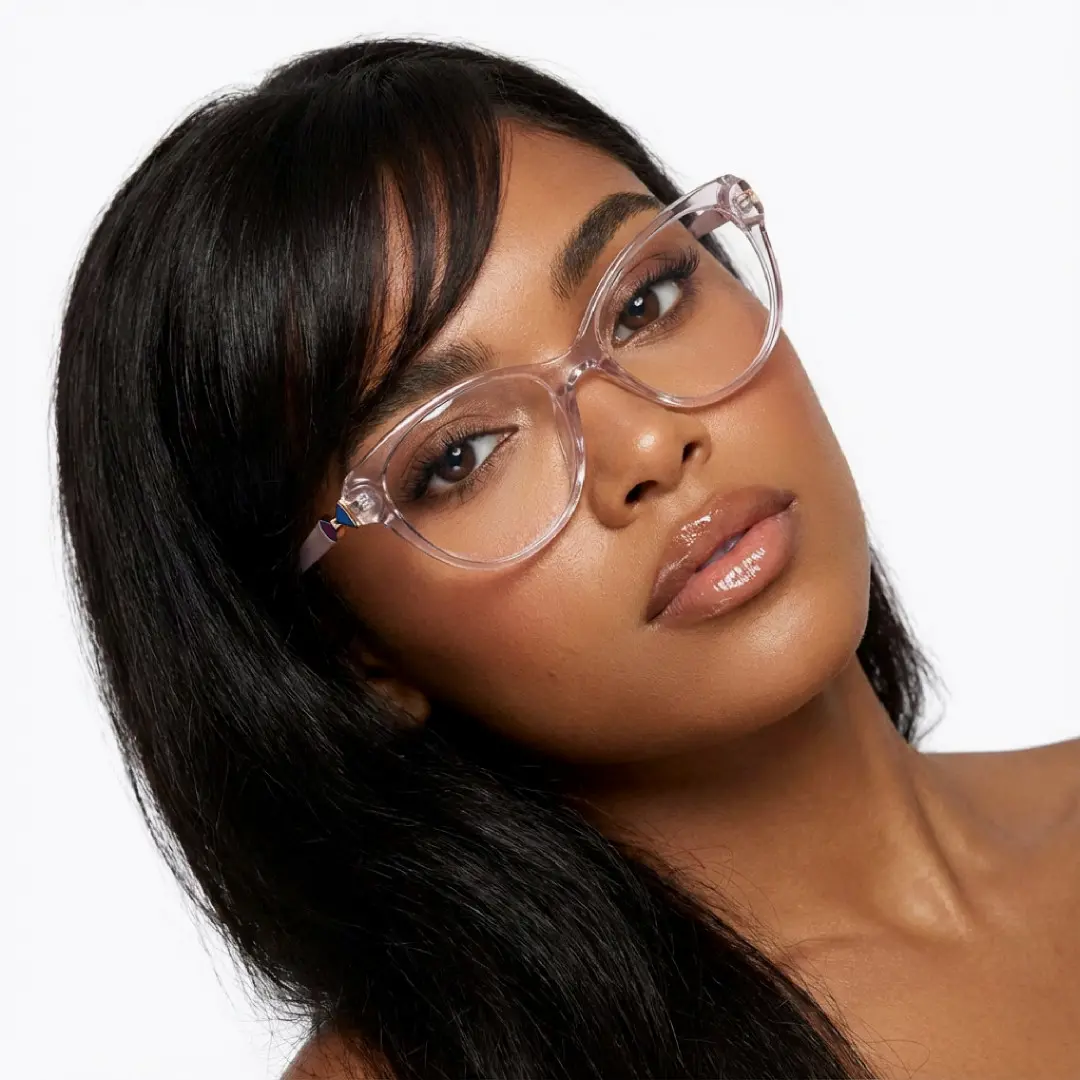 Front view of female wearing purple cat eye eyeglasses, tilting head, relaxed expression, CR0302509