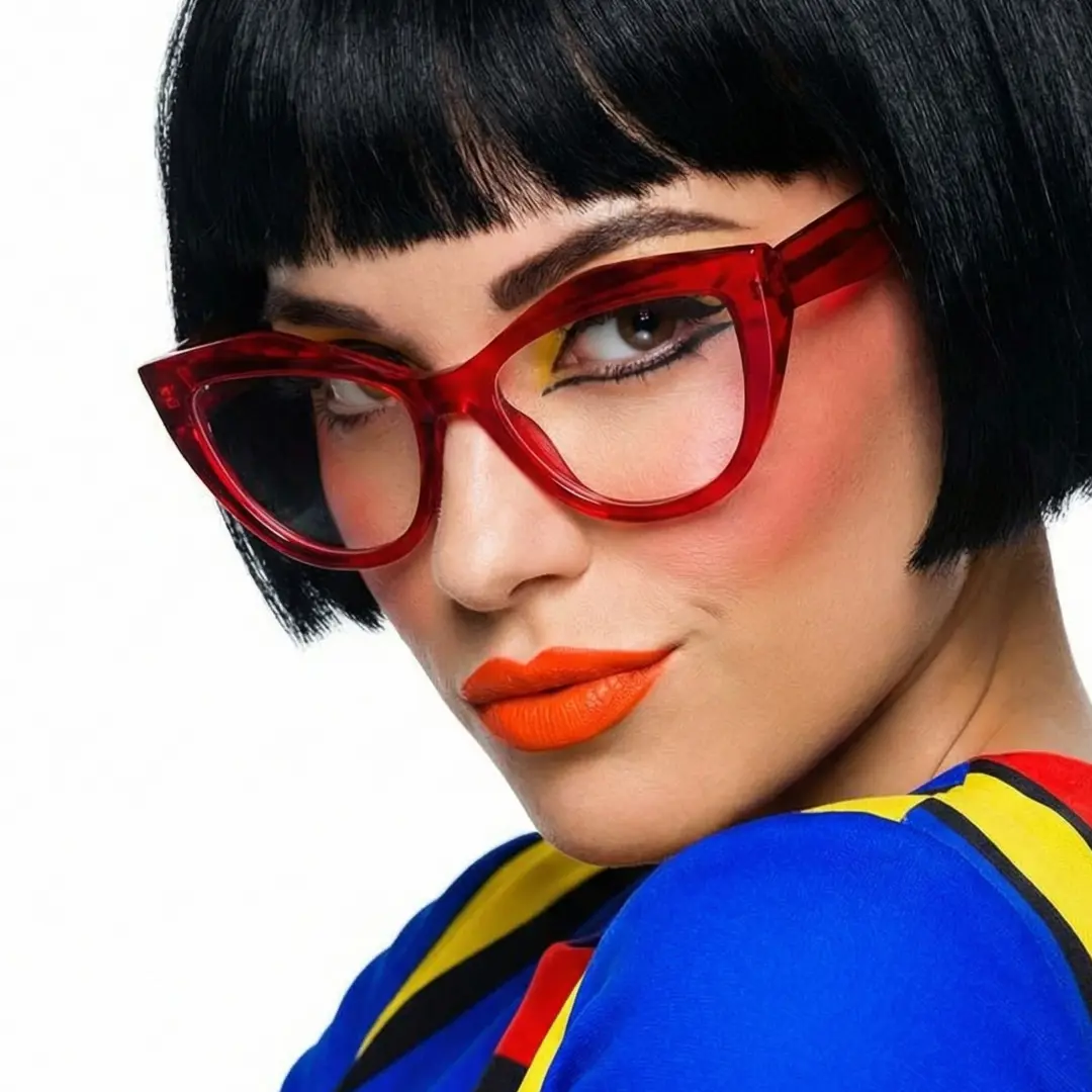 Profile view of female wearing red cat eye eyeglasses, smiling, CR0312405