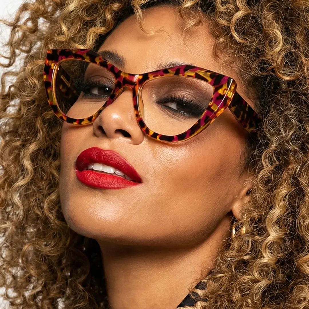 Close-up view of female wearing tortoise cat eye eyeglasses, smiling, CR0312405