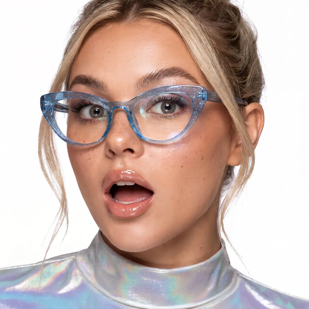 Close-up view of female wearing blue cat eye eyeglasses, open mouth, CR0312408