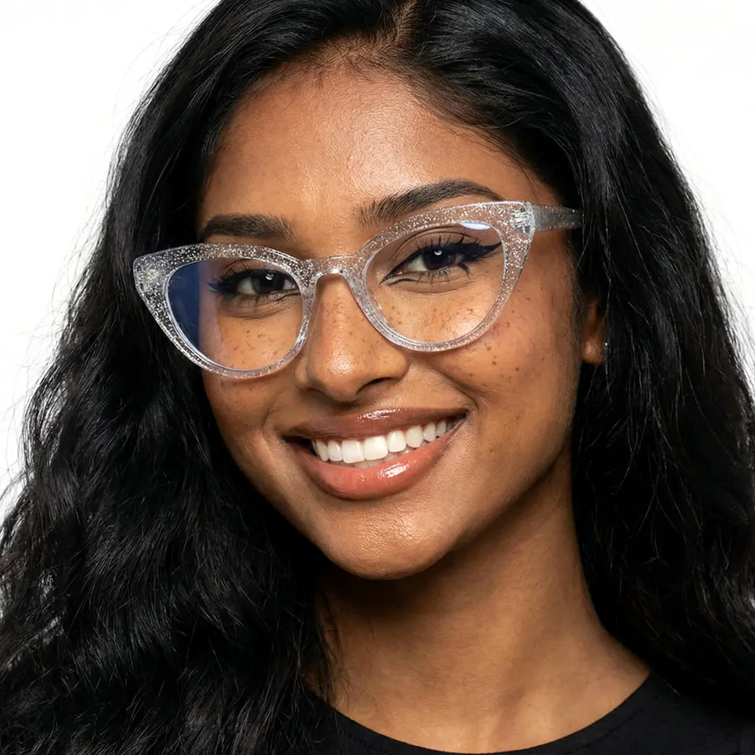 Front view of female wearing clear cat eye eyeglasses, smiling, CR0312408