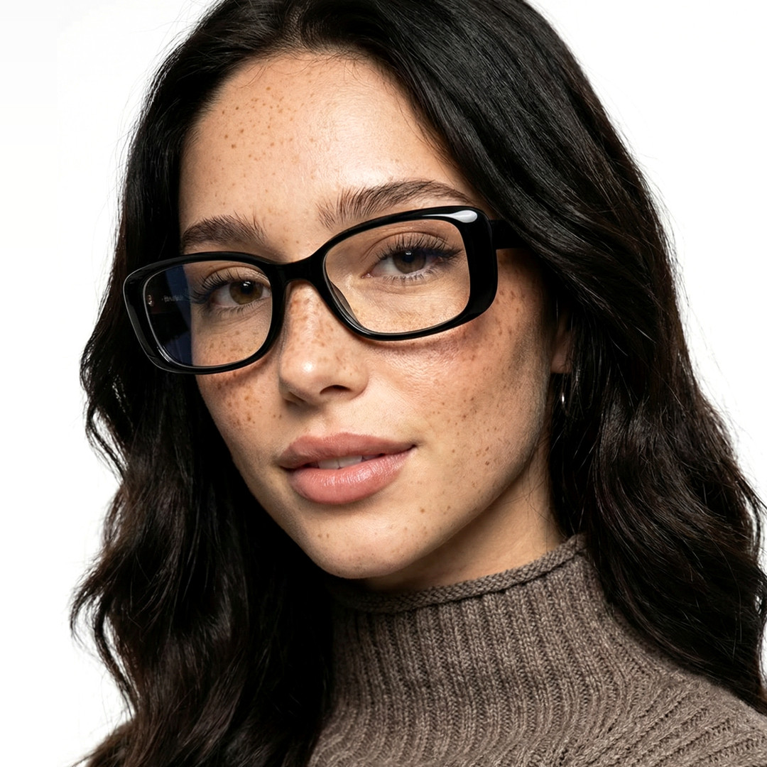 Three-quarter view of female wearing black cat eye eyeglasses, soft smile, CR0332601