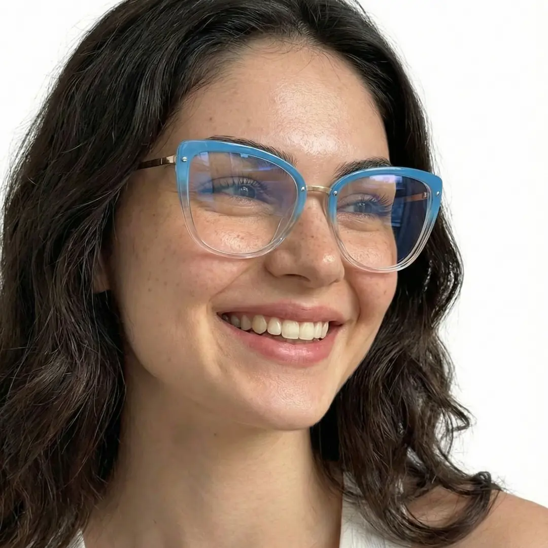 Profile view of female wearing blue cat eye eyeglasses, smiling, CR0342302