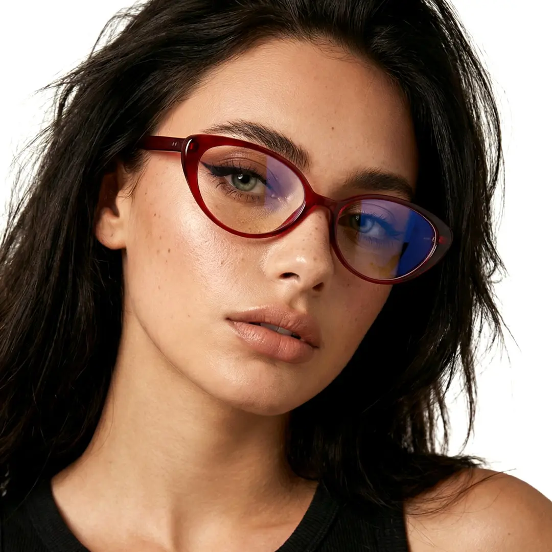 Three-quarter view of female wearing red cat eye eyeglasses, neutral expression, CR0382601