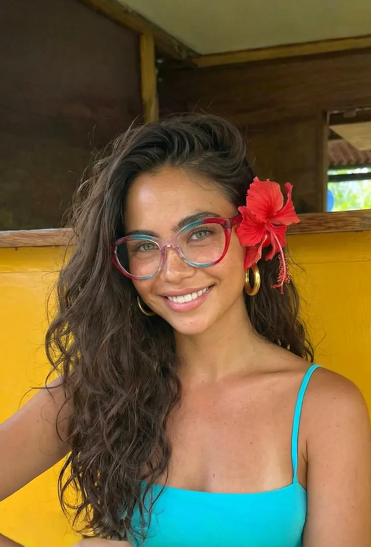 Female model wearing colorful red cat eye tr90 eyeglasses in an outdoor setting. SPU: CR0422302