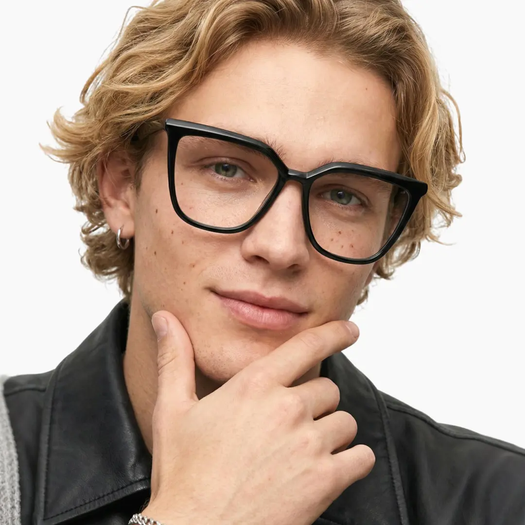 Front view of male wearing black cat eye eyeglasses, smiling, CR0442302