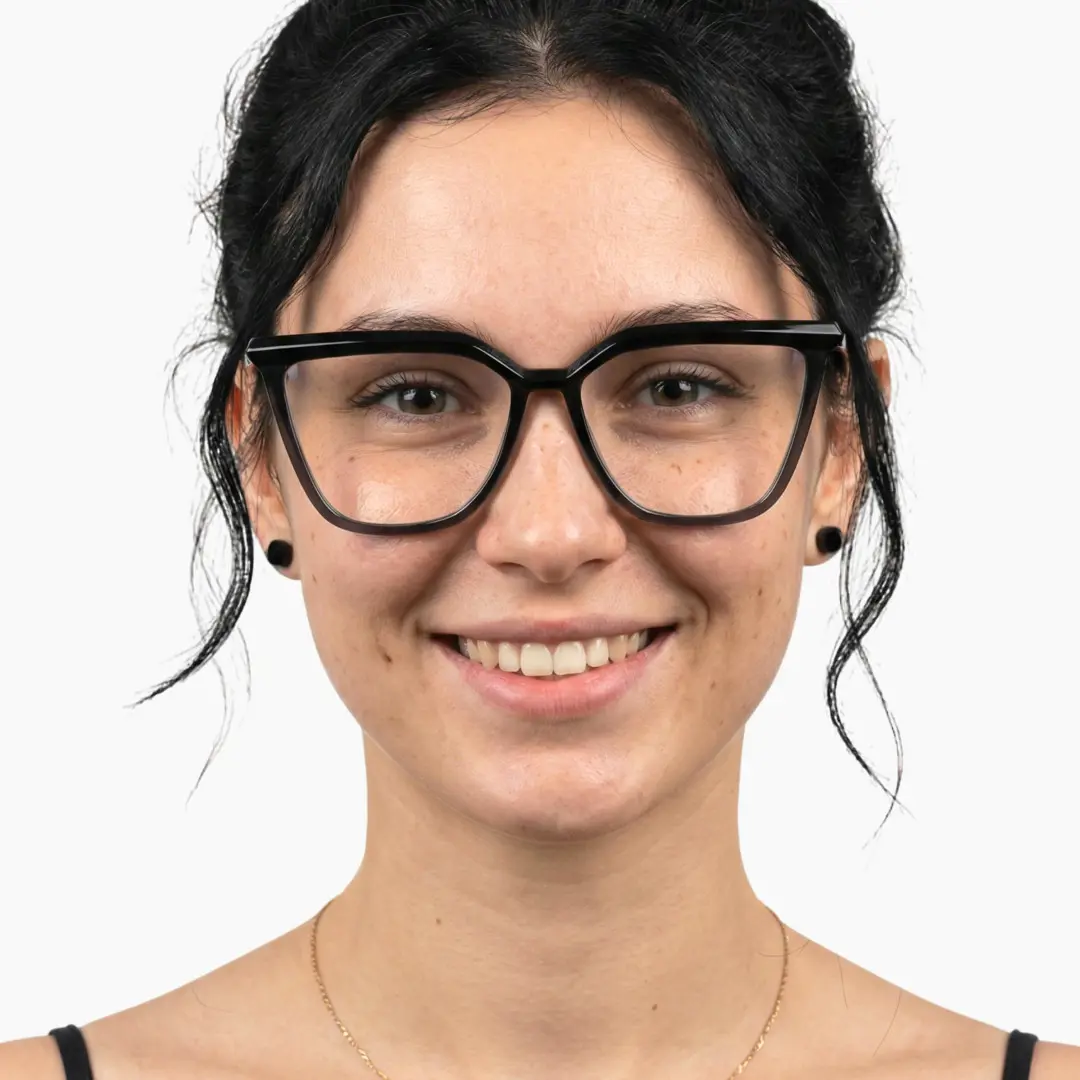 Front view of female wearing black cat eye eyeglasses, smiling, CR0442302
