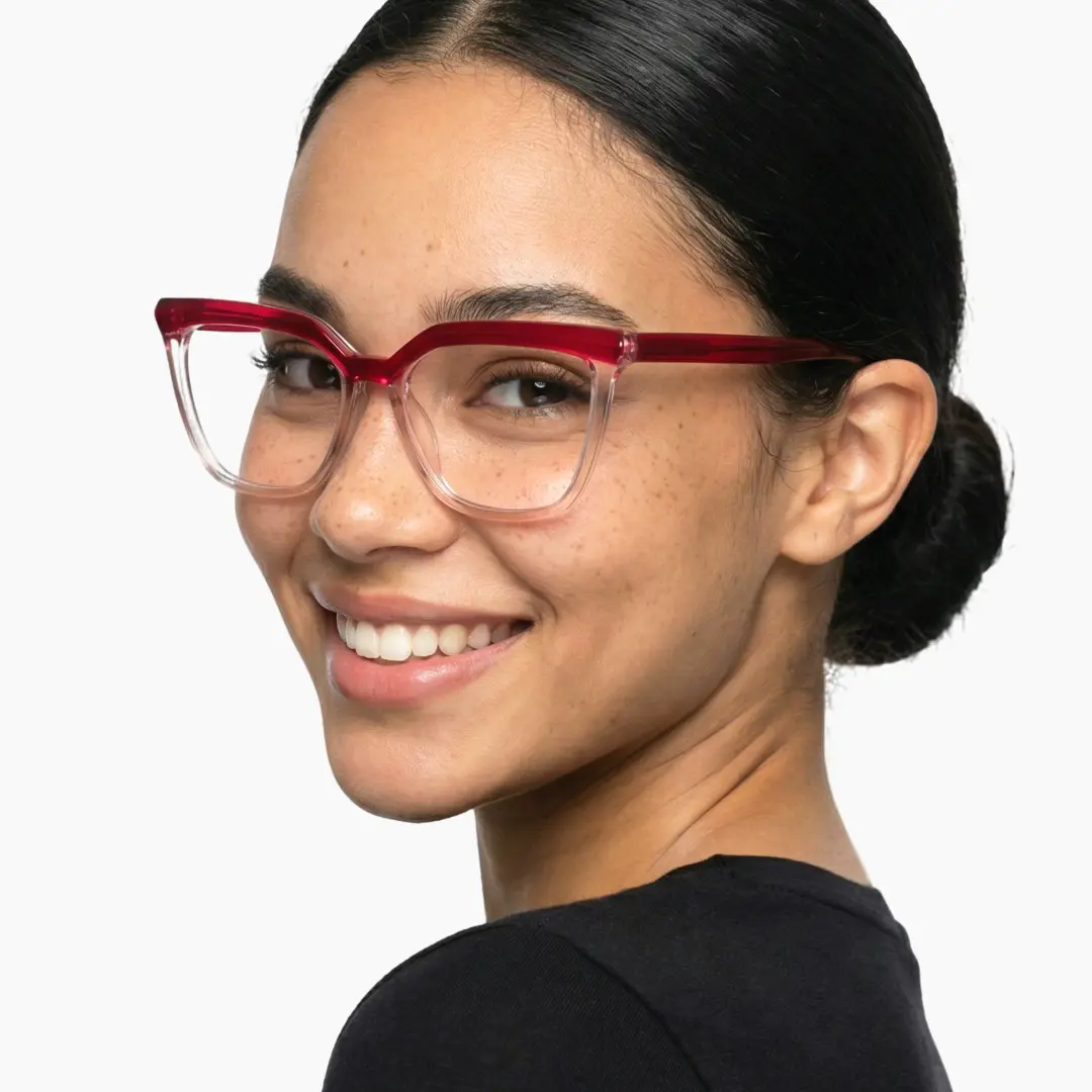 Profile view of female wearing red cat eye eyeglasses, natural smile, CR0442302