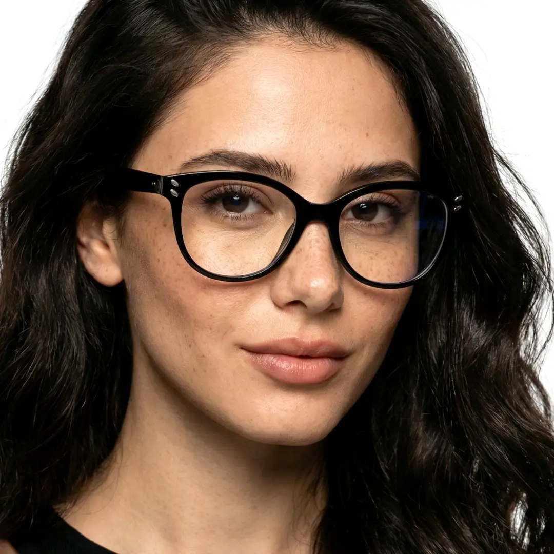 Front view of female wearing black cat eye eyeglasses, neutral expression, CR0472504