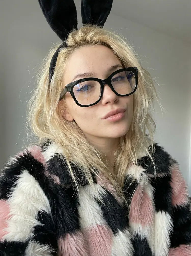 Female model wearing everyday black cat eye tr90 eyeglasses in an indoor setting. SPU: CR0532505