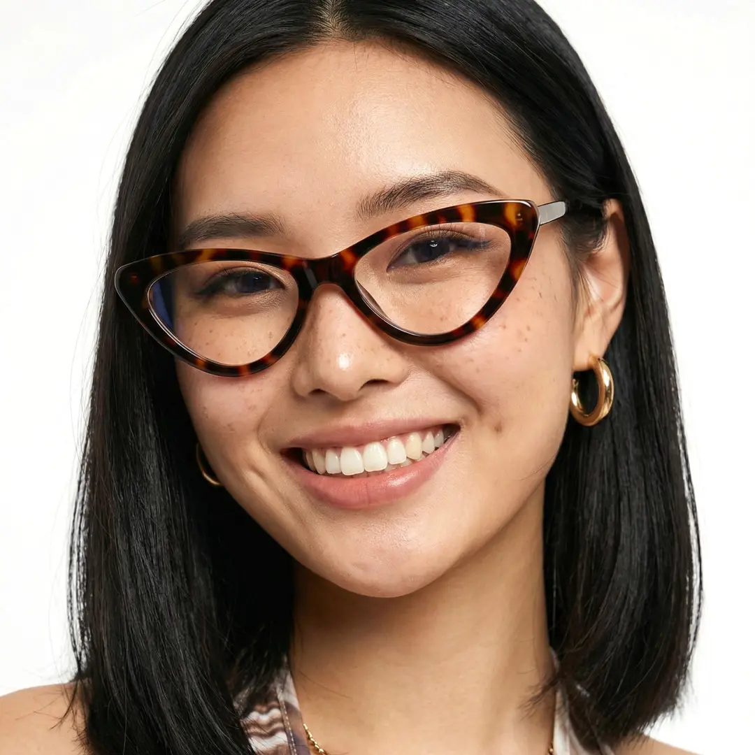 Close-up view of female wearing vintage tortoise cat eye eyeglasses, natural smile, CR0642302