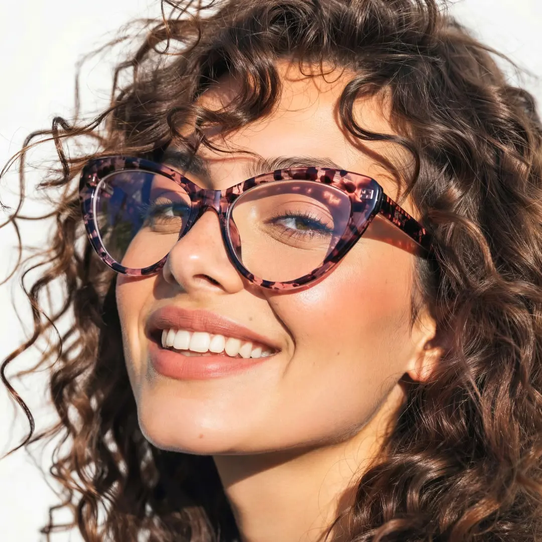 Profile view of female wearing brown tortoise cat eye eyeglasses, smiling, CR0902302