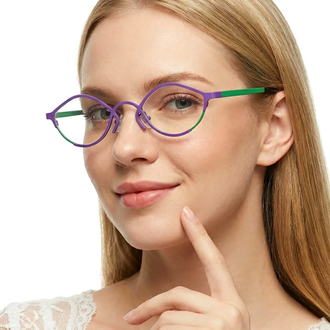 Three-quarter view of female wearing purple cat eye eyeglasses, hand near face, soft smile, CT0062407