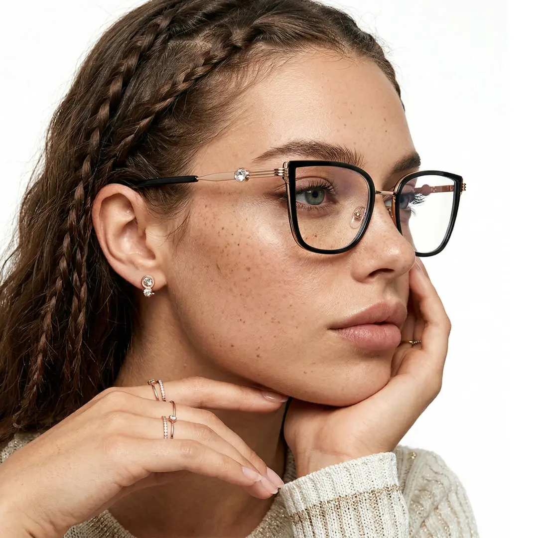 Profile view of female wearing black cat eye eyeglasses, resting chin on hand, neutral expression, CX0052604