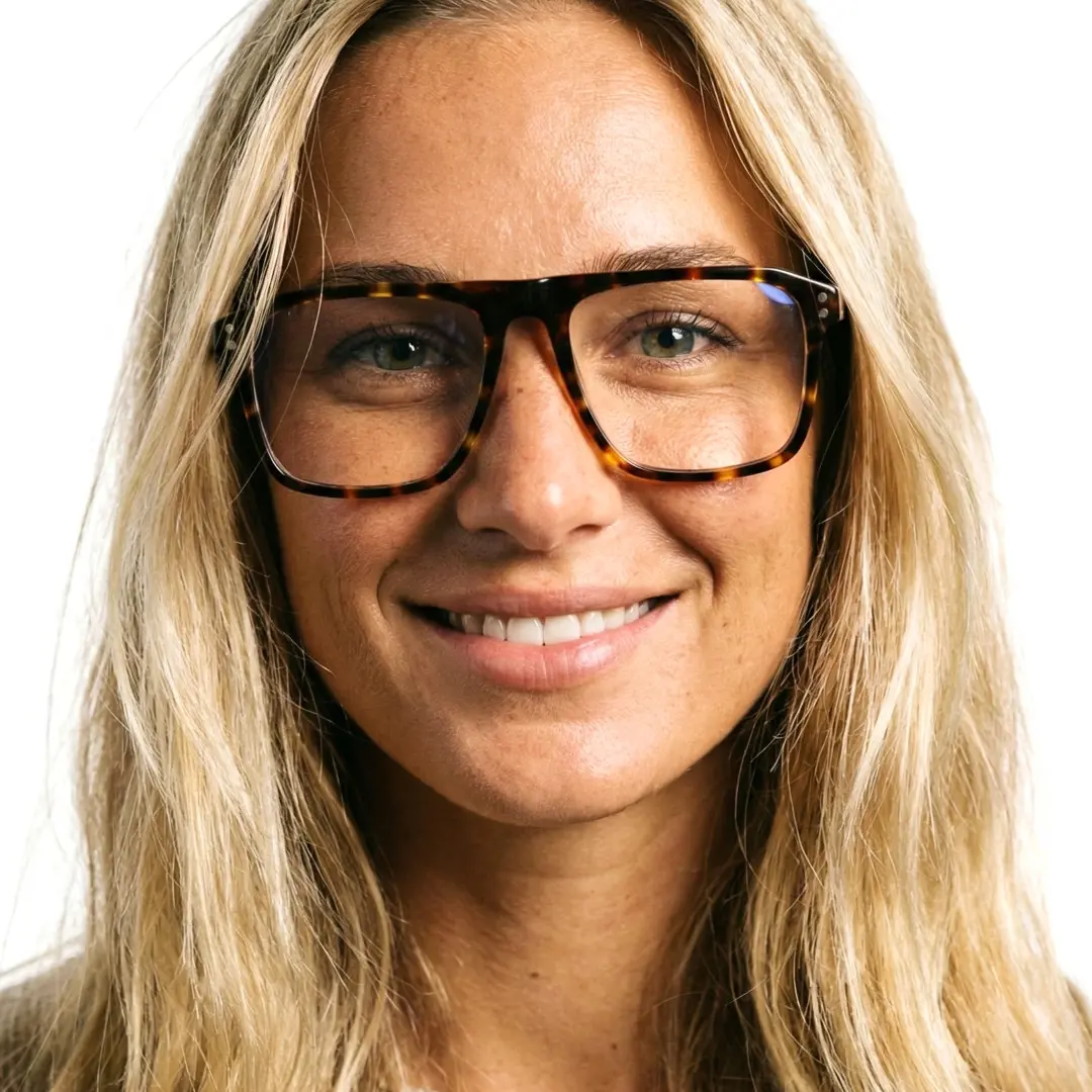Front view of female wearing tortoise rectangle eyeglasses, soft smile, EA0012508