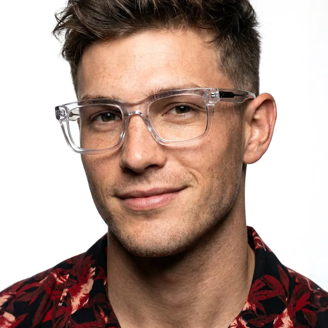 Face close-up view of female wearing clear rectangle eyeglasses, smiling, EA0062305