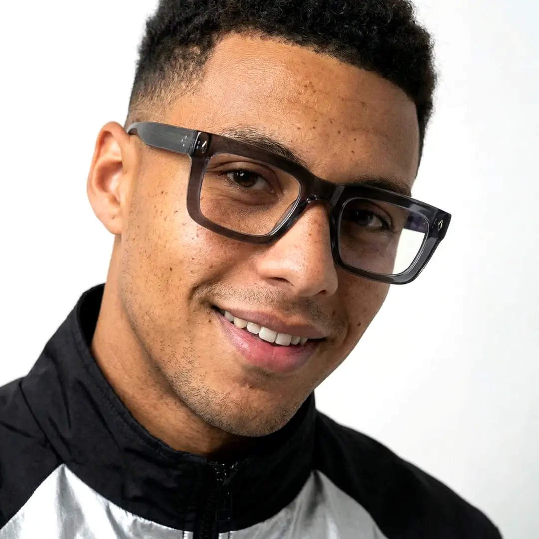 Three-quarter view of male wearing silver rectangle eyeglasses, natural smile, EA0062305