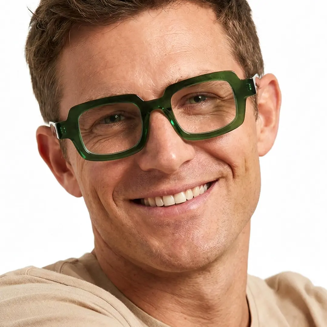 Looking straight ahead view of male wearing green rectangle eyeglasses, friendly smile, EA0072302